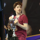 Umutcan (center) holding the Just Dance Word Cup trophy beside Pamela (right) and Uitregt left).